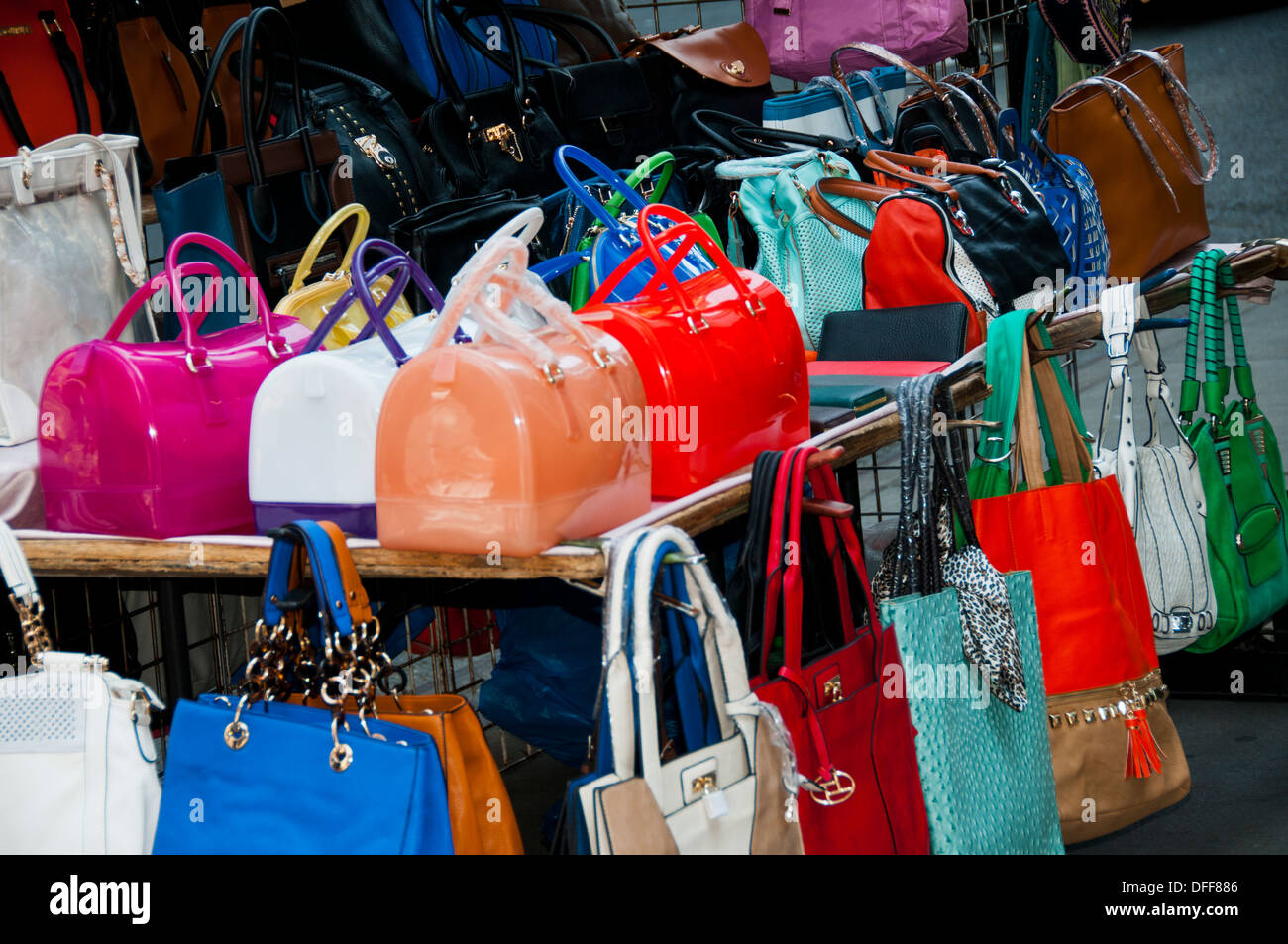 Street vendors on Canal Street selling imitation designer bags in all kinds  of weather. 