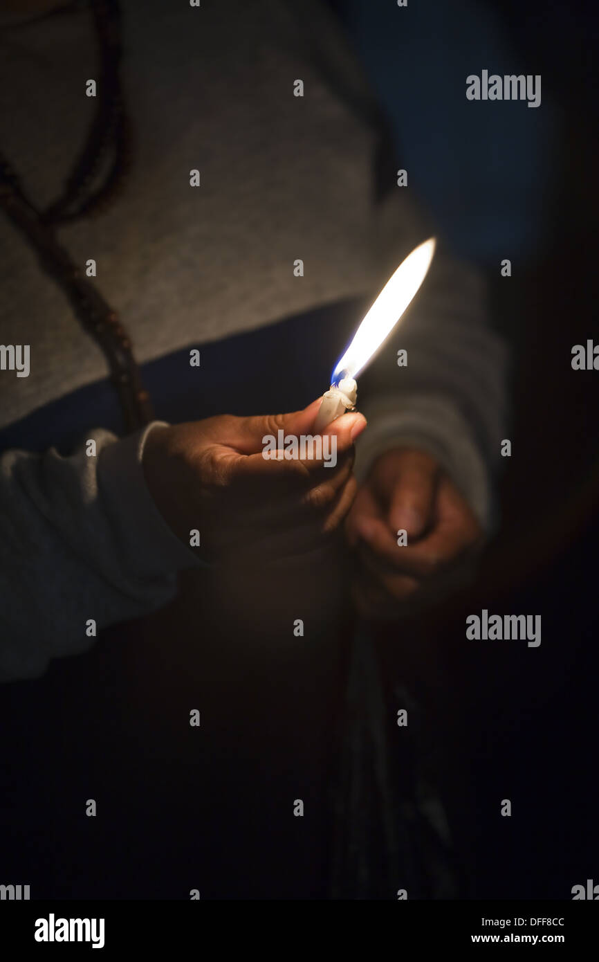 Hand holding candle Stock Photo Alamy