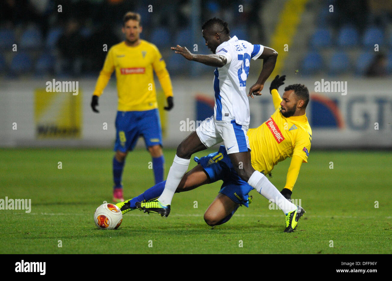 Liberec, Czech Republic. 3rd Oct, 2013. Joao Pedro Galvao of GD Estoril Praia soccer team, right, fights for the ball with Dzon Delarge of Slovan Liberec, left, during their Europa League Group H match in Liberec, Czech Republic, Thursday, October 3, 2013. Credit:  Radek Petrasek/CTK Photo/Alamy Live News Stock Photo