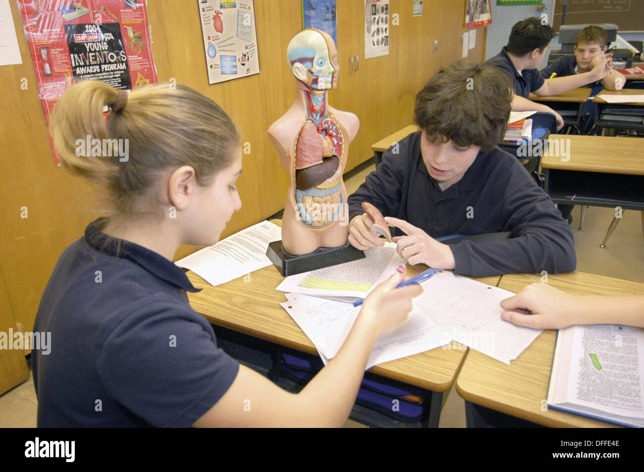 eighth-grade-students-doing-science-class-activities-catholic-school