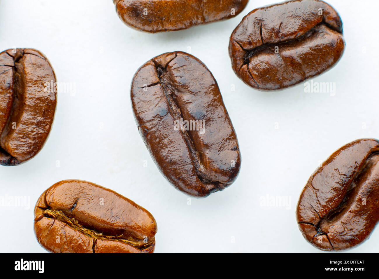 roasted coffee beans arabica in white background Stock Photo - Alamy