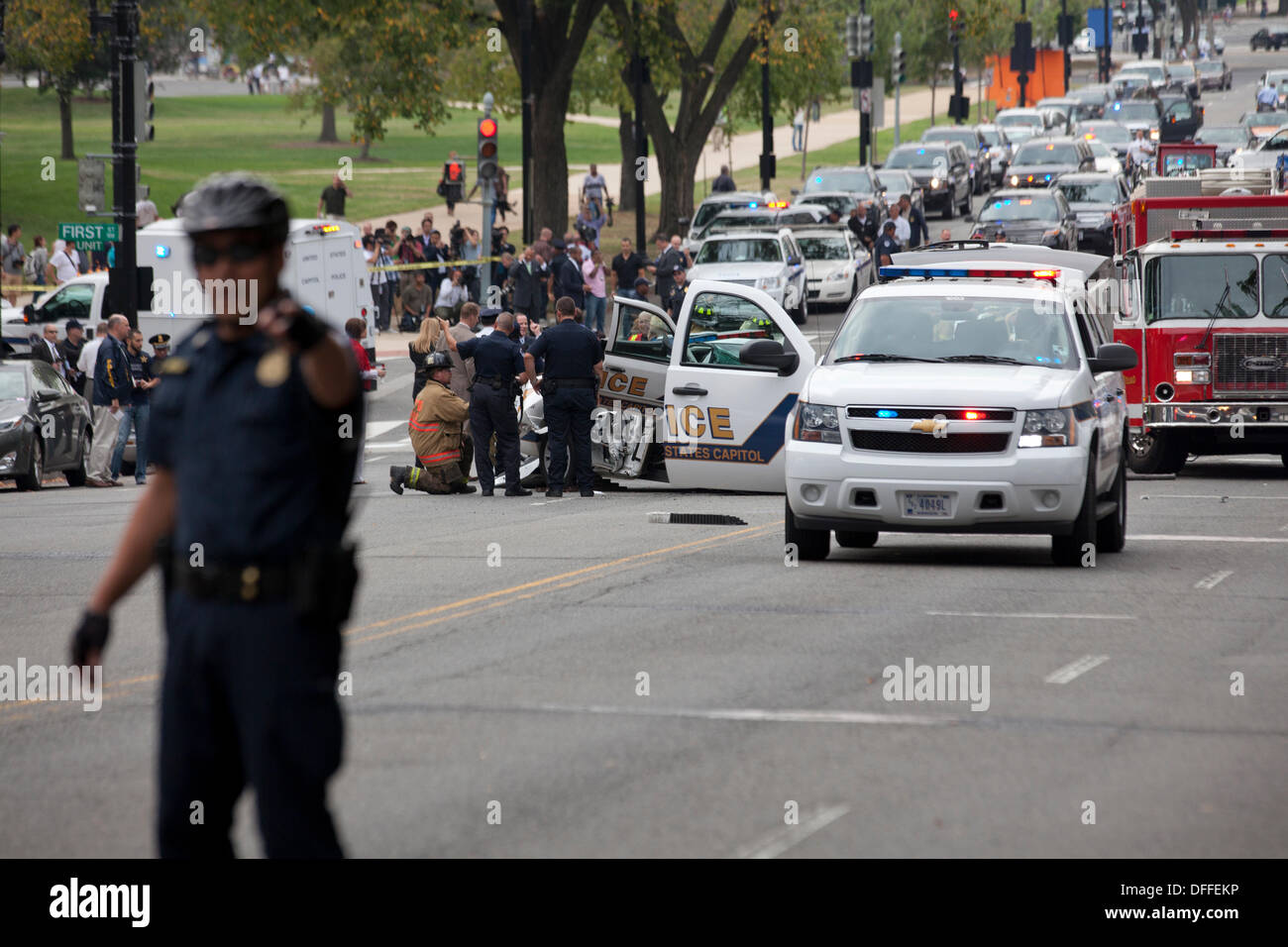 Washington, DC, USA. 3rd Oct, 2013:  US Secret Service and Capitol Police chase a woman who tried to ram security gate at the White House with her car.  A car chase ensues from the White House to the US Capitol building.  The chase ends in a crash, shots are fired by Capitol Police.  The woman driver is confirmed dead, a Capitol Policeman is injured. © B Christopher/Alamy Live News Stock Photo