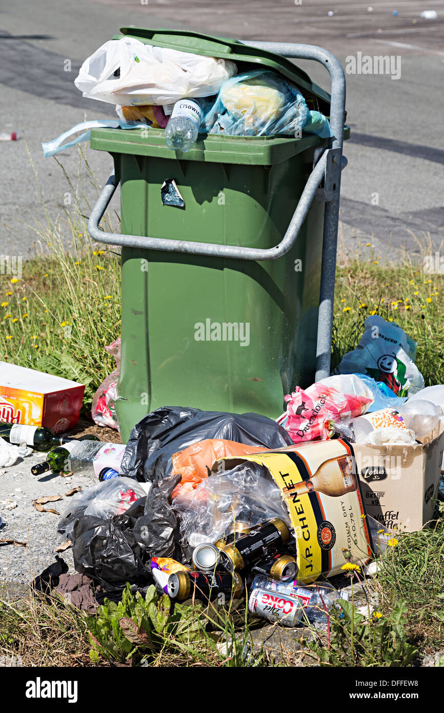 Rubbish overflowing from roadside bin at motorway services, Belgium Stock Photo