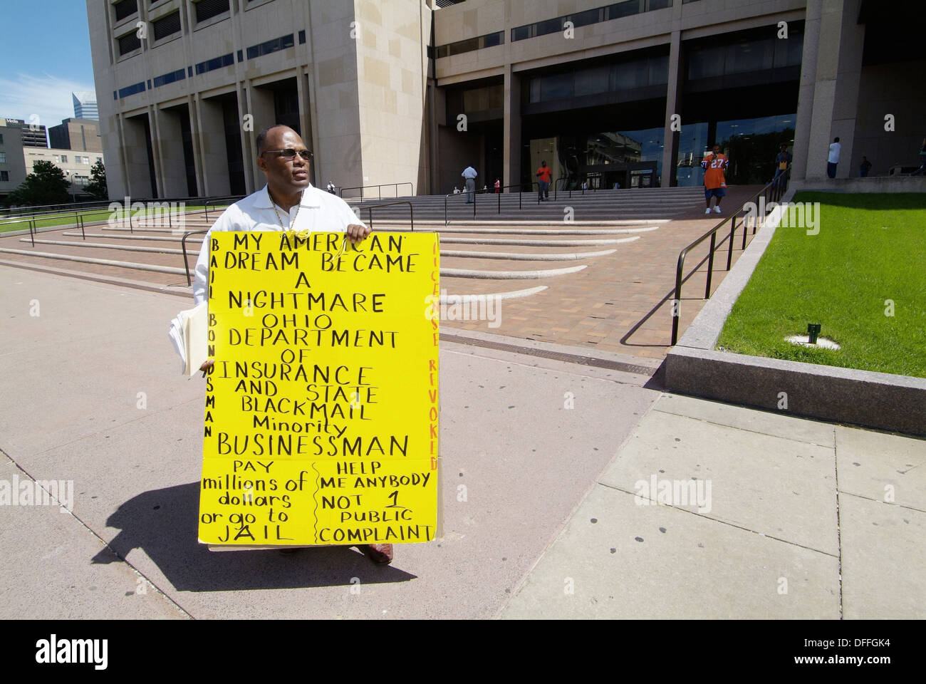 Adult black male protestor demonstrates in front of the Cleveland Ohio municipal building. USA. Stock Photo