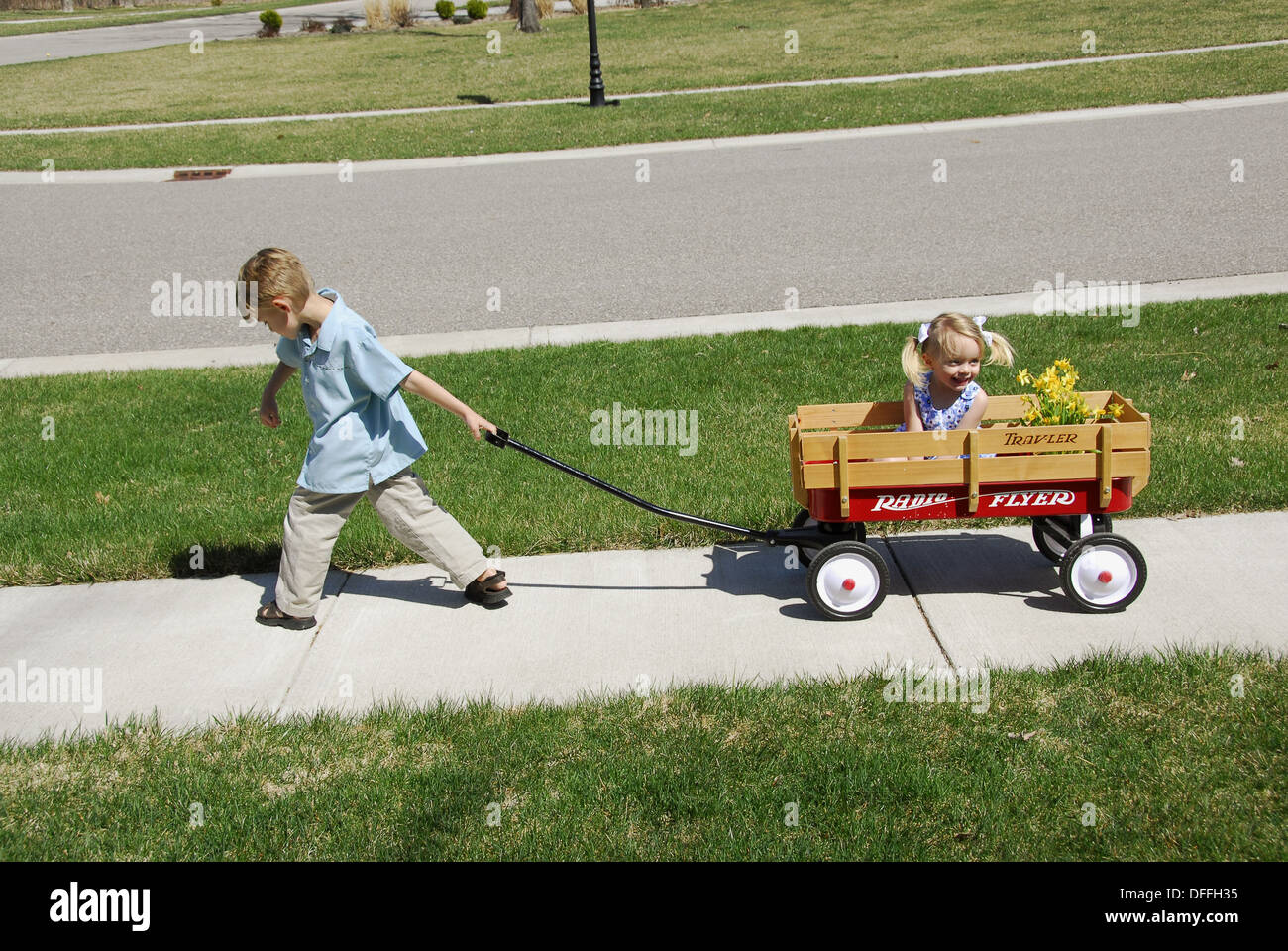 children in a wagon Showing the concept of pulling and pushing pull