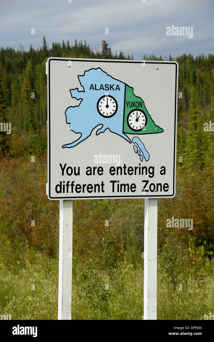 Time zone change sign marker at border of Yukon Territory Canada and