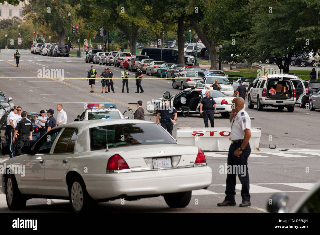 Washington, DC, USA. 3rd Oct, 2013:  US Secret Service and Capitol Police chase a woman who tried to ram security gate at the White House with her car.  A car chase ensues from the White House to the US Capitol building.  The chase ends in a crash, shots are fired by Capitol Police.  The woman driver is confirmed dead, a Capitol Policeman is injured. © B Christopher/Alamy Live News Stock Photo