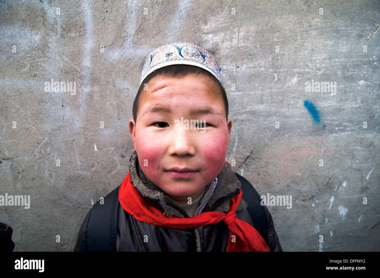 Portrait of a cute Hui Muslim boy taken in Gansu, China Stock Photo
