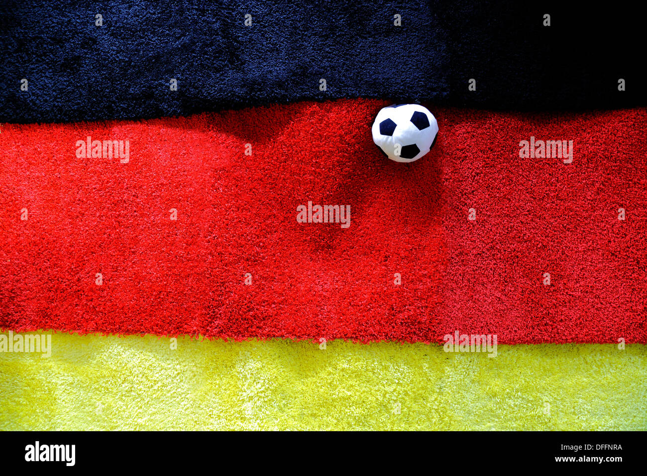 football on German flag which is made of three carpets Stock Photo