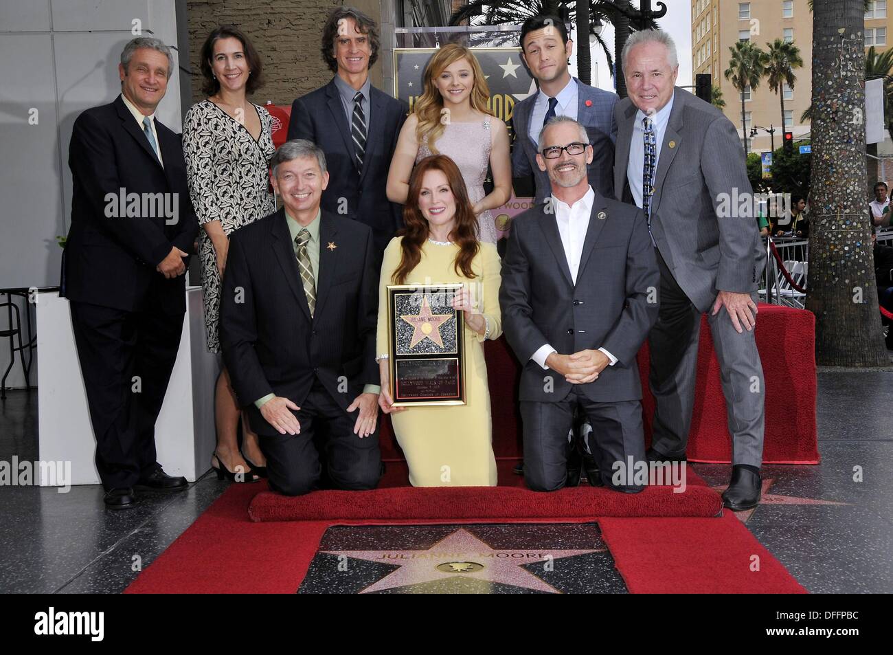 Los Angeles, CA. 3rd Oct, 2013. David Green, Heather Cochran, Leron Gubler, Jay Roach, Julianne Moore, Chloe Grace Moretz, Joseph Gordon Levett, Mitch O'Farrell, Tom LaBong at the induction ceremony for Star on the Hollywood Walk of Fame for Julianne Moore, Hollywood Boulevard, Los Angeles, CA October 3, 2013. © Michael Germana/Everett Collection/Alamy Live News Stock Photo
