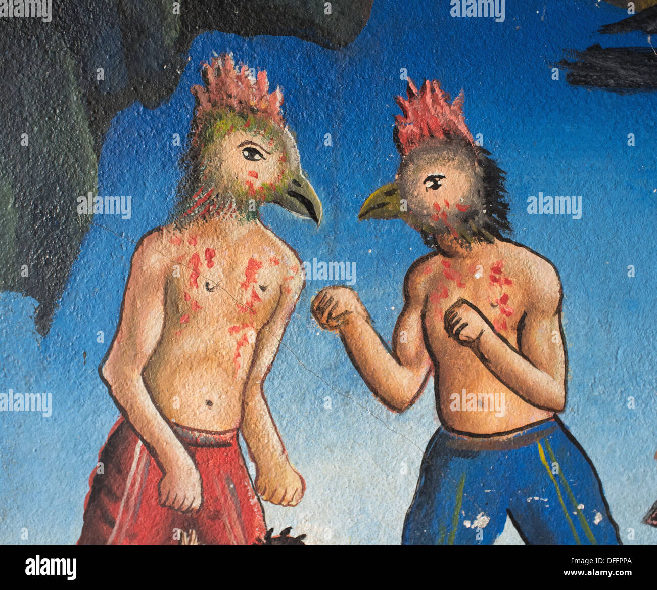 The karmic punishment for cockfighting, shown in a detail of a Cambodian temple mural depicting Buddhist Hell. Stock Photo