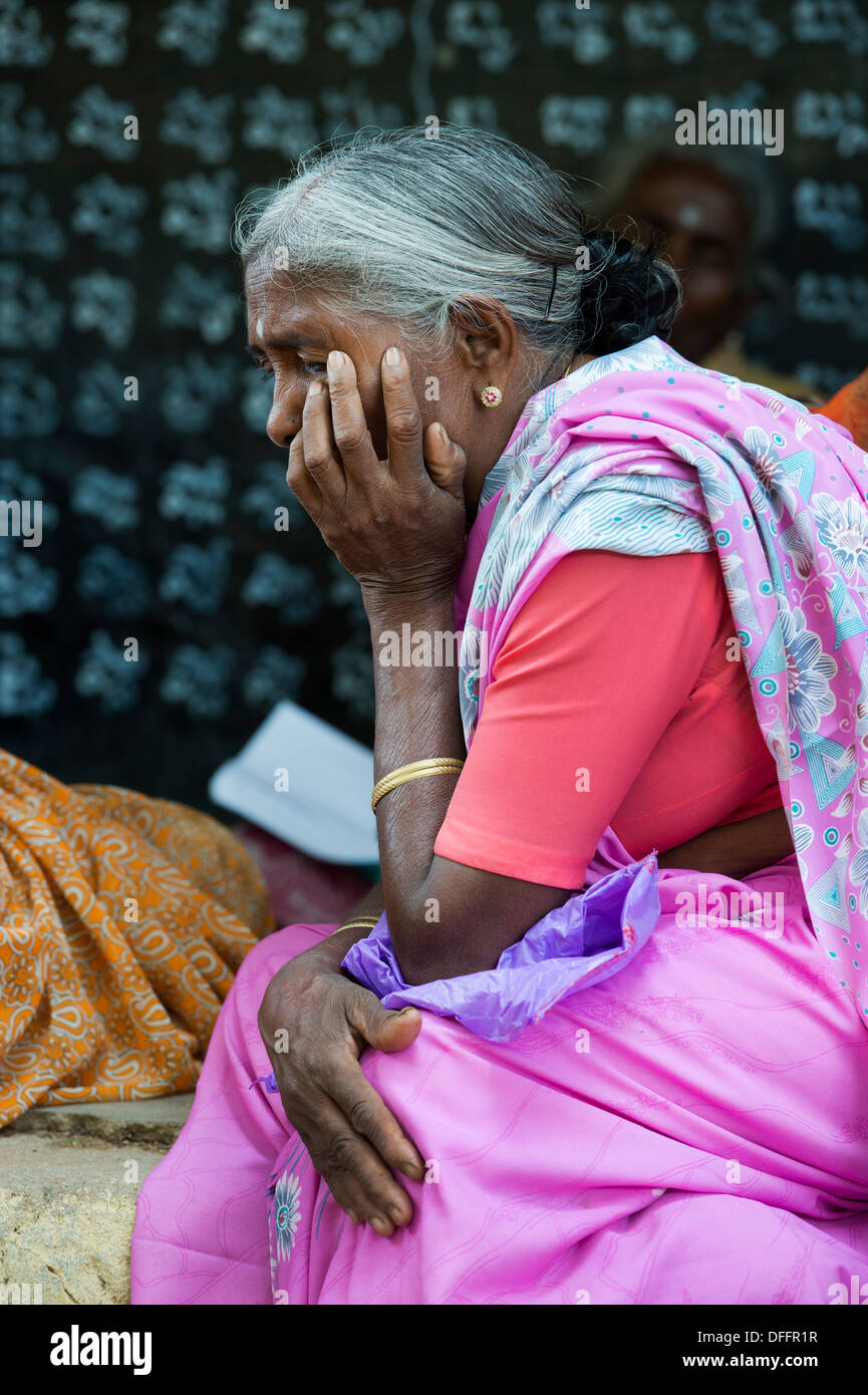 Partially sighted indian villagers waiting for the eye clinic at Sri Sathya Sai Baba mobile outreach hospital. India Stock Photo
