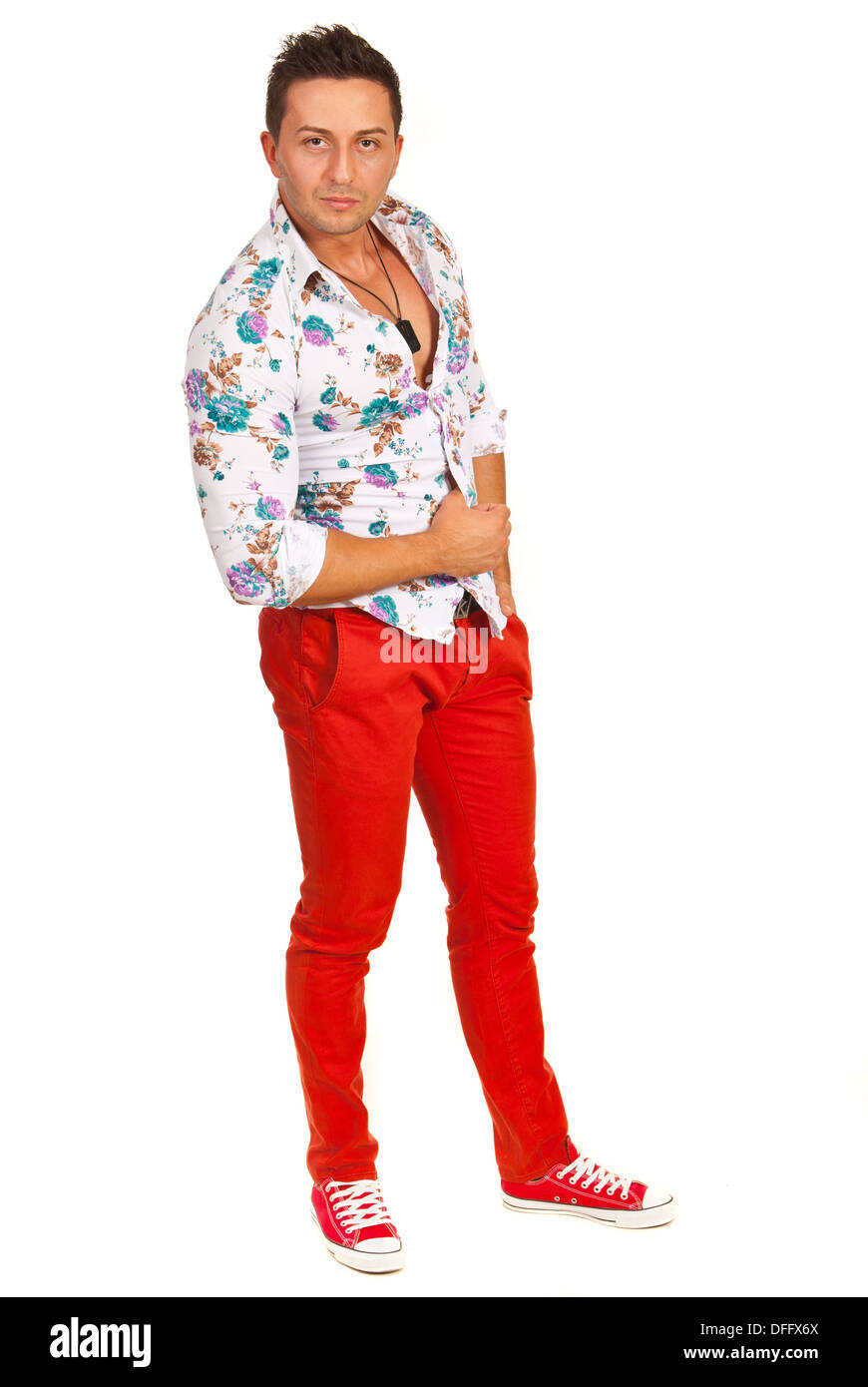 Model man posing in floral shirt and red pants isolated on white background  Stock Photo - Alamy