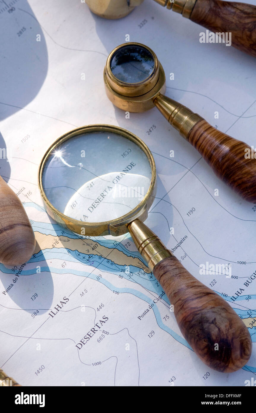 Still life of Map with Antique Magnifying Glass Stock Photo