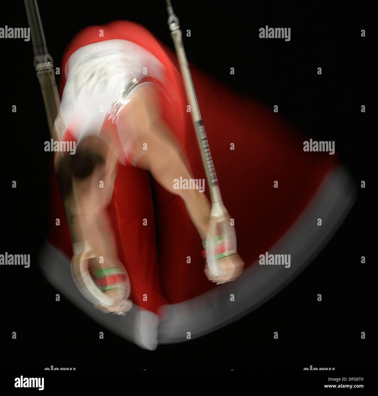 Antwerp, Belgium. 03rd Oct, 2013. Oliver Hegi from Switzerland performs on the rings during the Artistic Gymnastics World Championships in Antwerp, Belgium, 03 October 2013. Photo: MIRJAN MURAT EDITORIAL USE ONLY/dpa/Alamy Live News Stock Photo