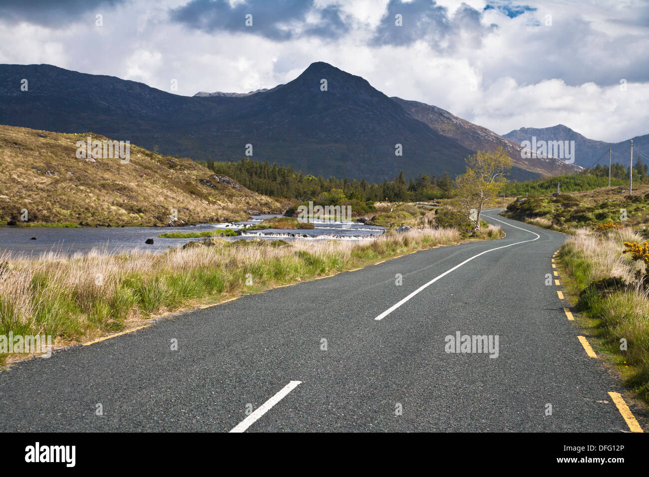 Deserted road and Owenmore River in Connemara, County Galway, Ireland, Europe Stock Photo