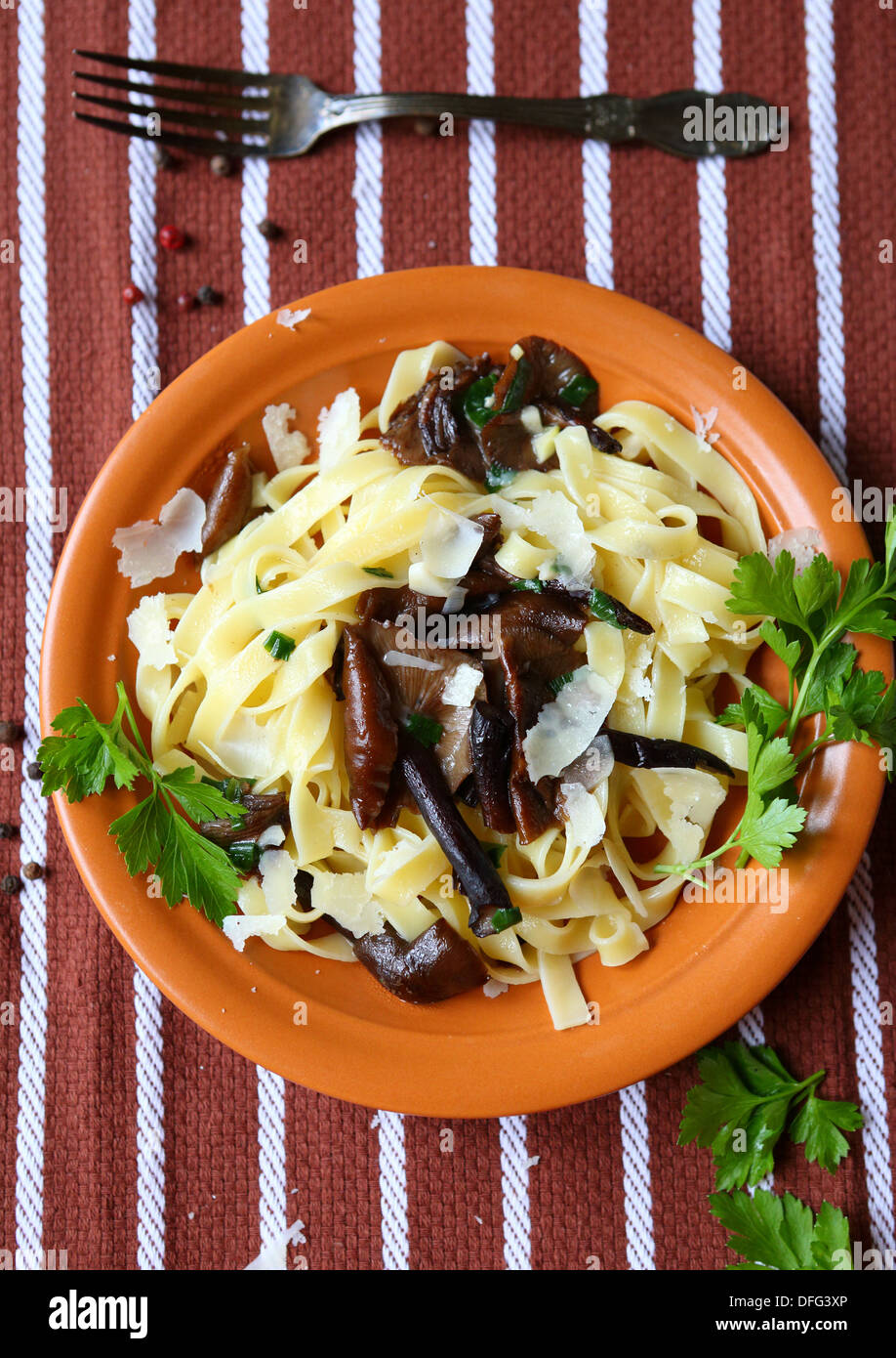 Tagliatelle pasta with fried mushrooms, top view food Stock Photo