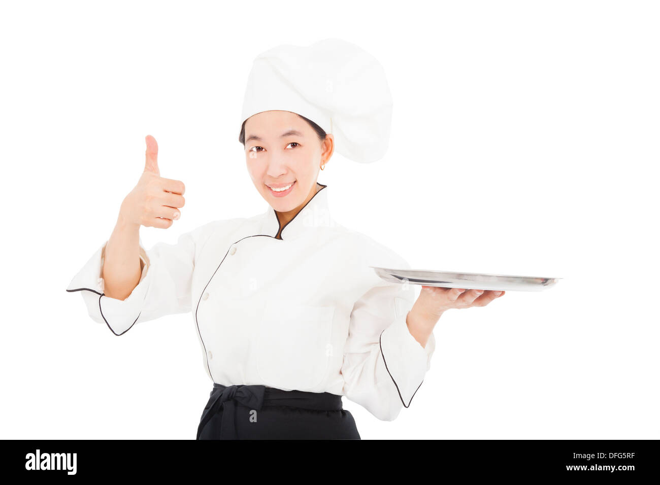 smiling young woman chef with thumb up Stock Photo