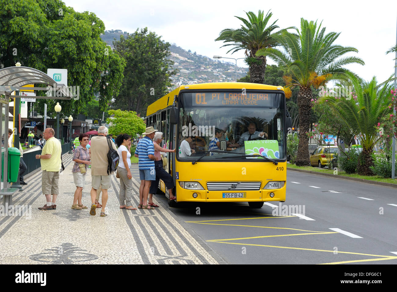 Tourists boarding a local commuter bus in Funchal Madeira Portugal Stock Photo