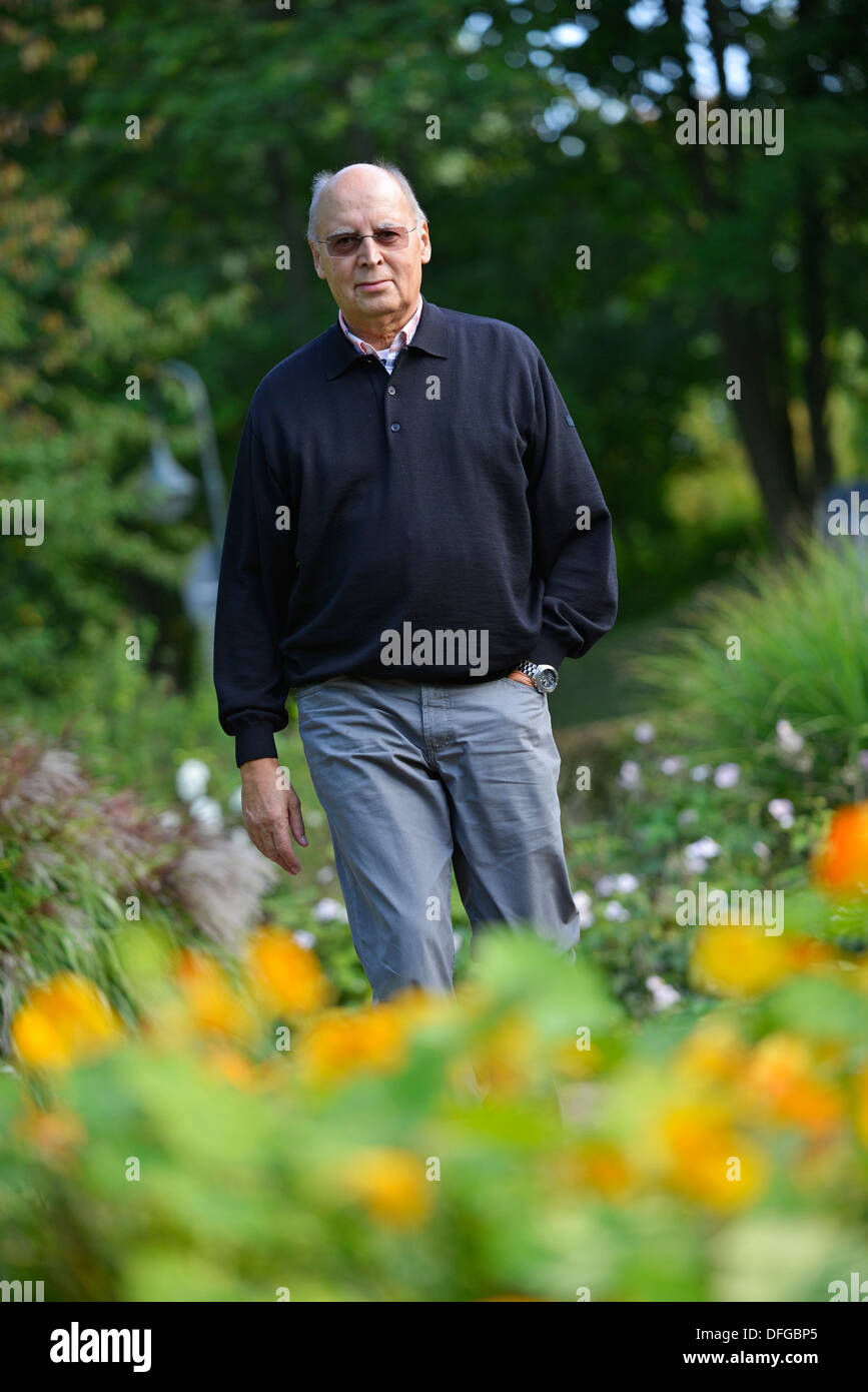 Typical pensioner in a park in autumn. Stock Photo
