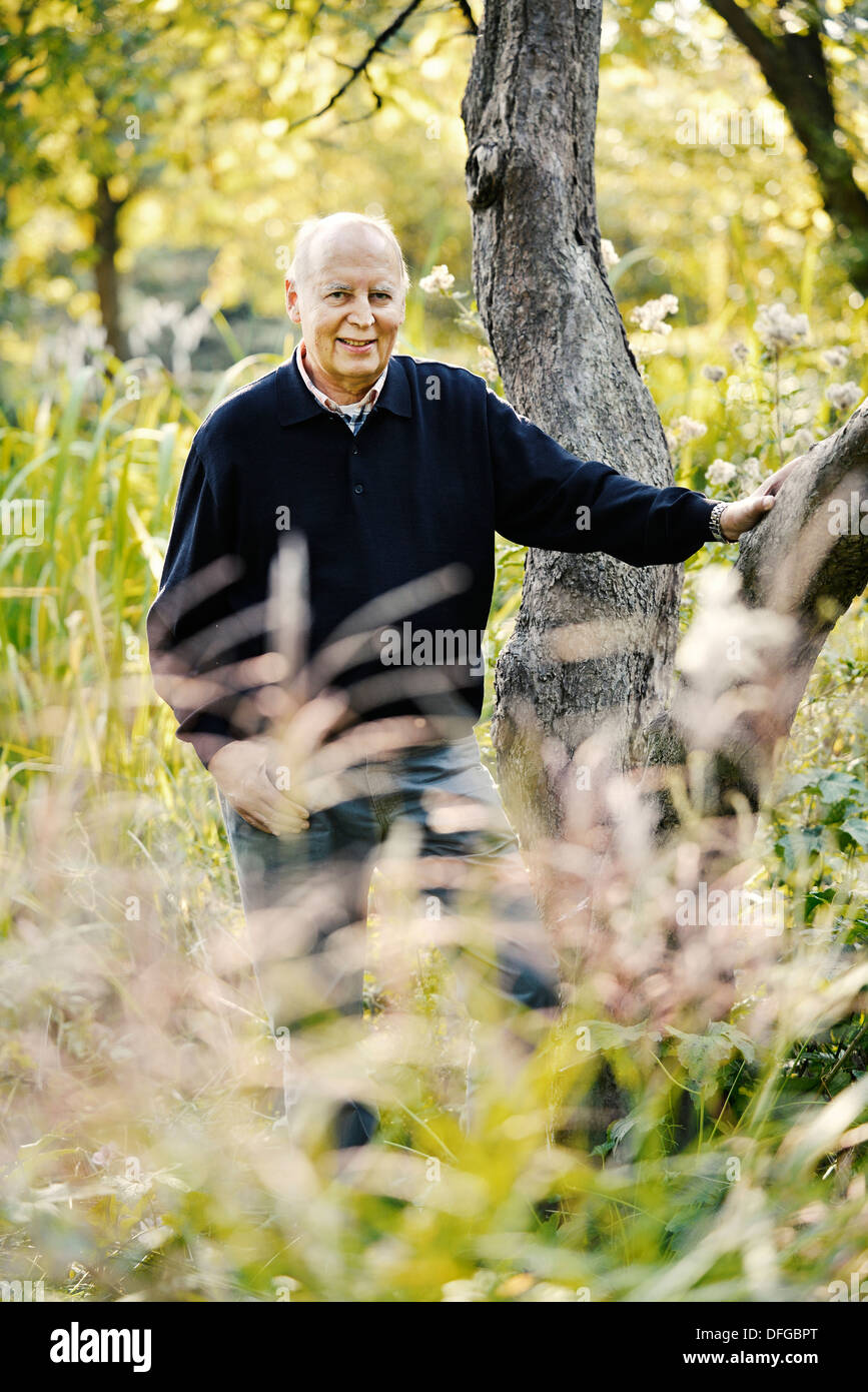 Typical pensioner in a park in autumn. Stock Photo