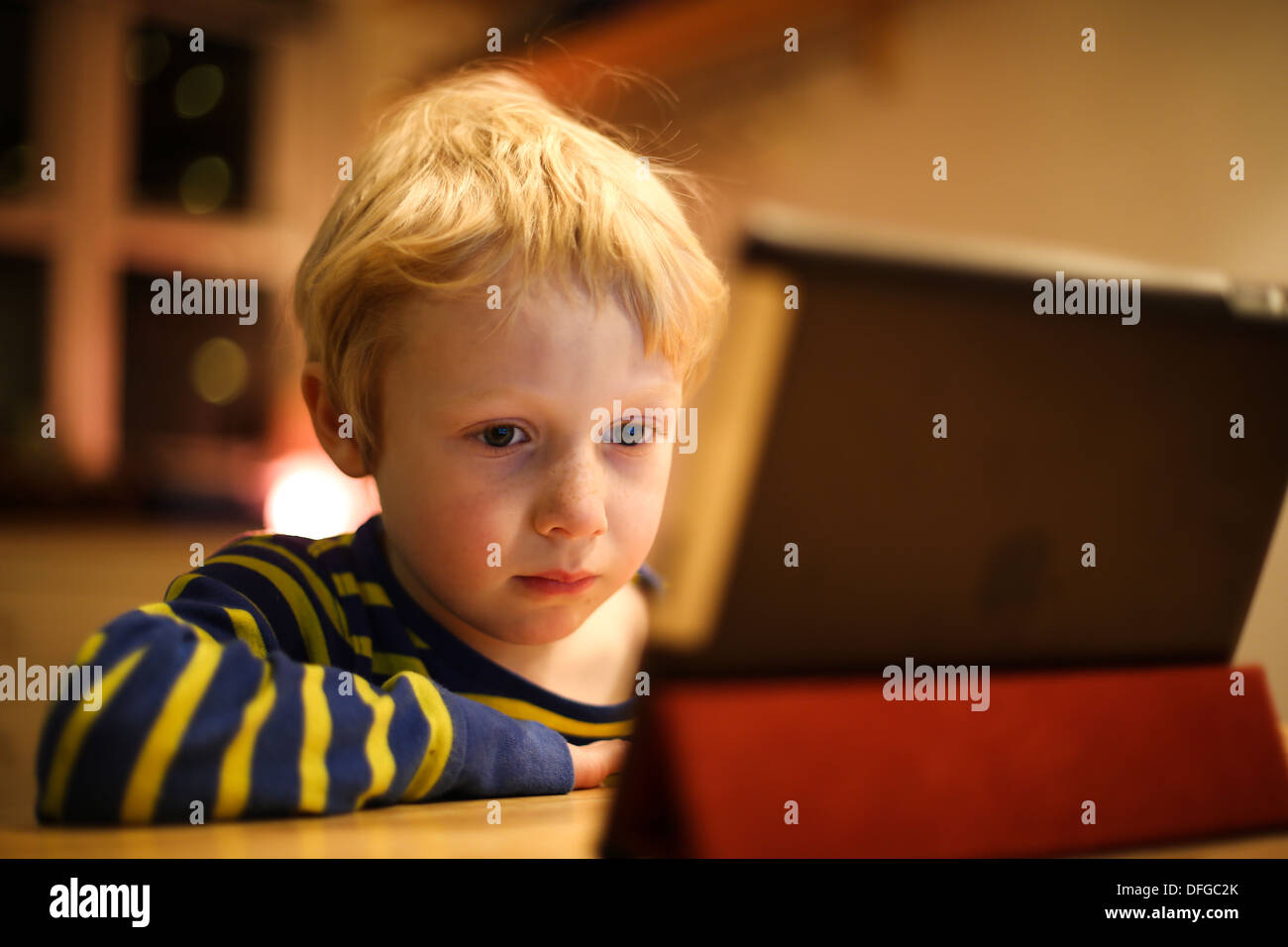Child captivated by an iPad Stock Photo