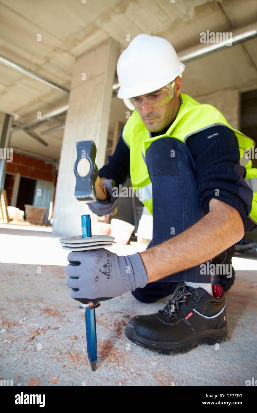 Construction worker with sledgehammer and pointer, Building hand tool