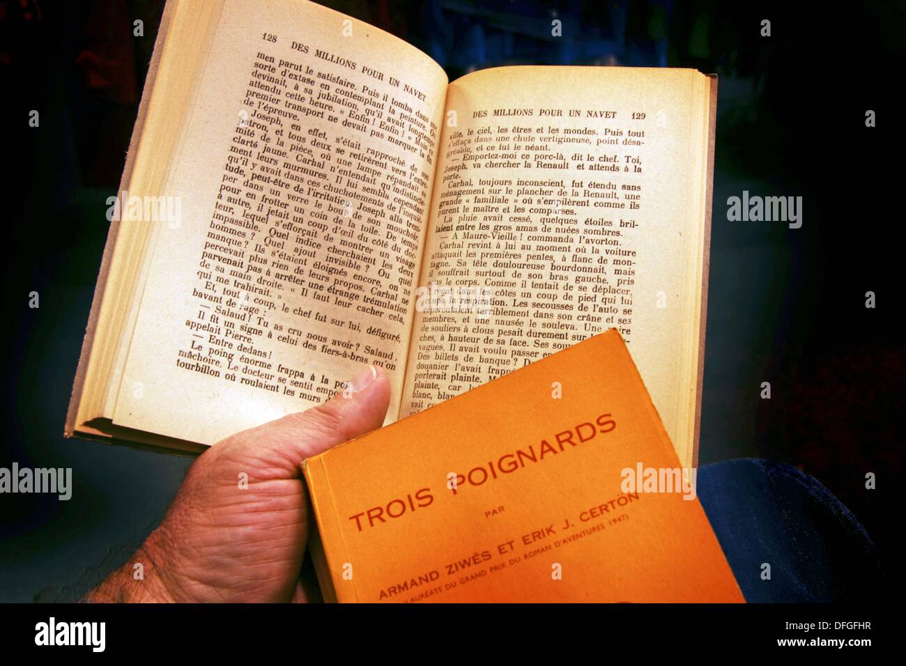 Reading a crime novel in French, France Stock Photo Alamy