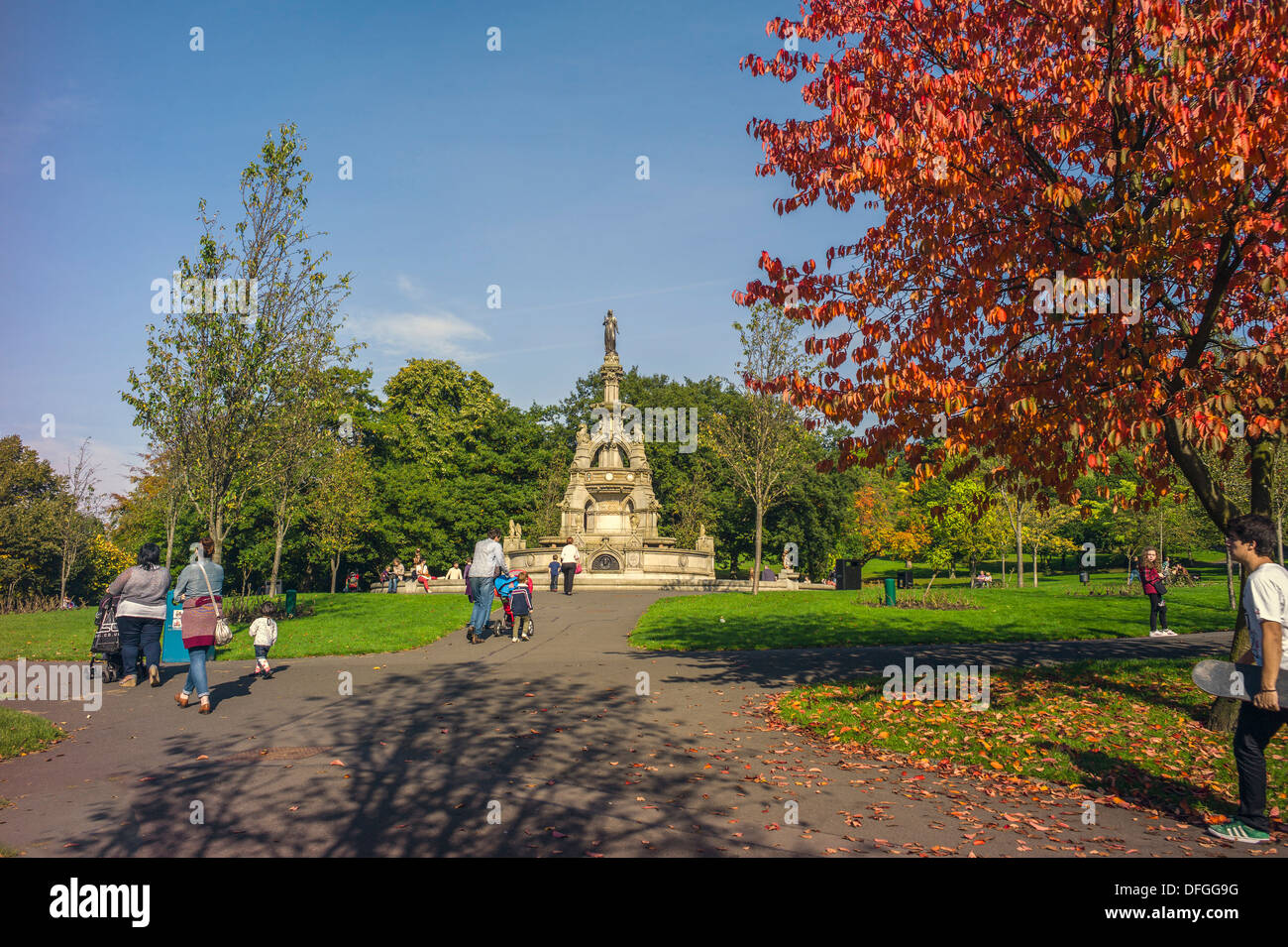 The Stewart memorial fountain is located within the Kelvingrove Park Glasgow and is shown with an autumn tinged tree background Stock Photo