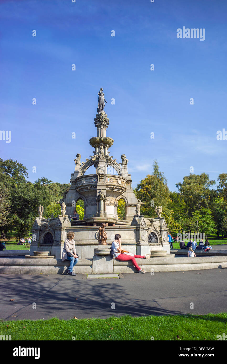 The Stewart memorial fountain is located within the Kelvingrove Park Glasgow and is shown with an autumn tinged tree background Stock Photo