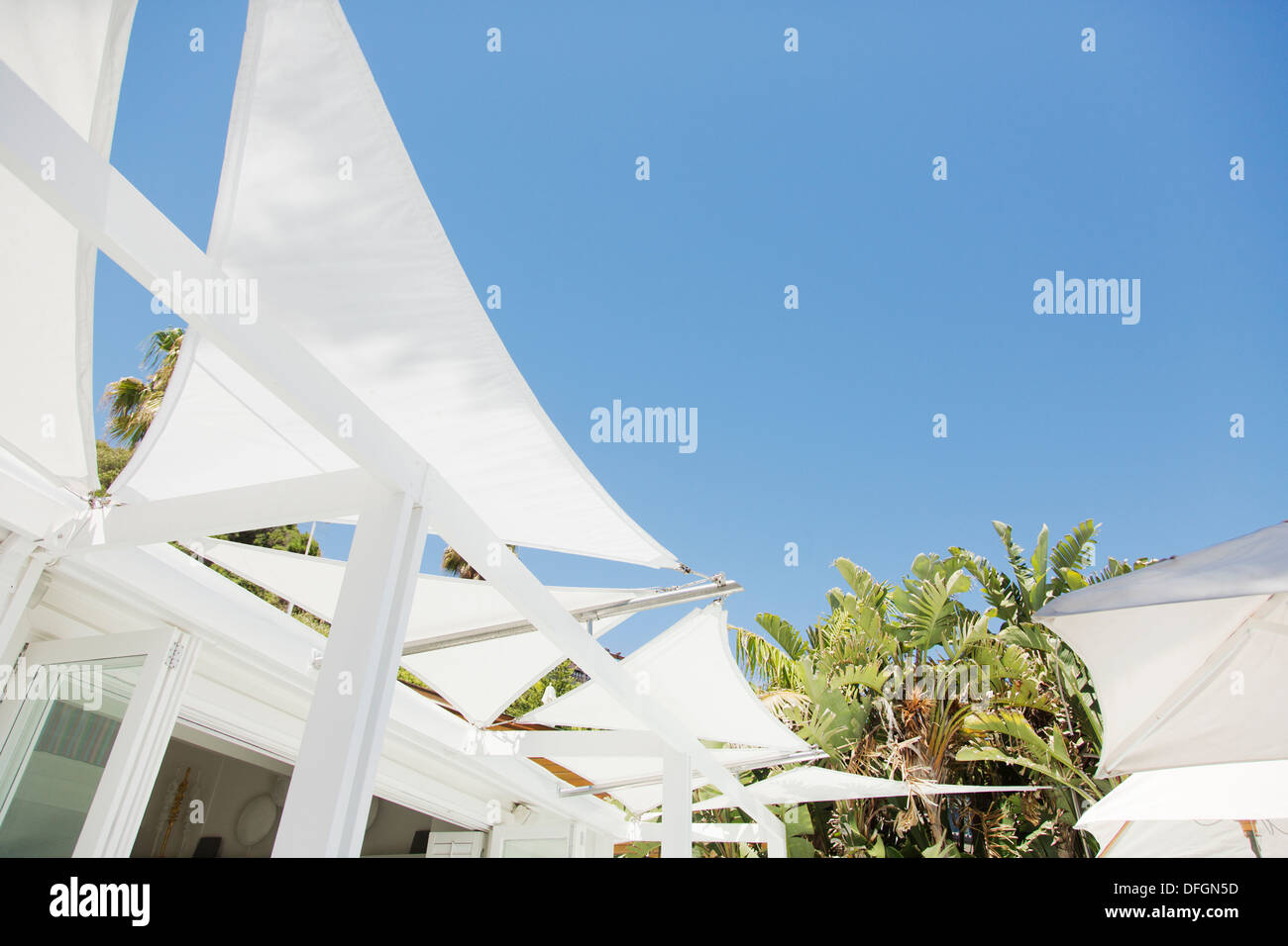 White awnings against blue sky Stock Photo