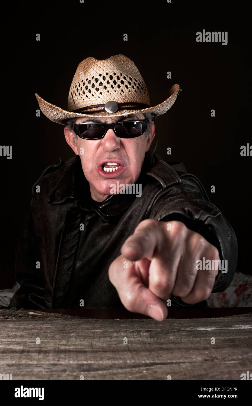 Angry man with cowboy hat Stock Photo