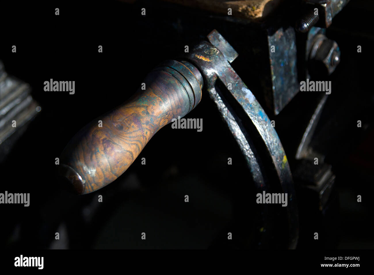 A printing press is a device for evenly printing ink on to a print