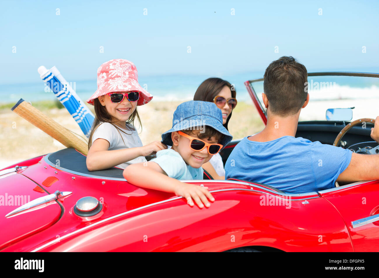 Family riding in convertible at beach Stock Photo Alamy