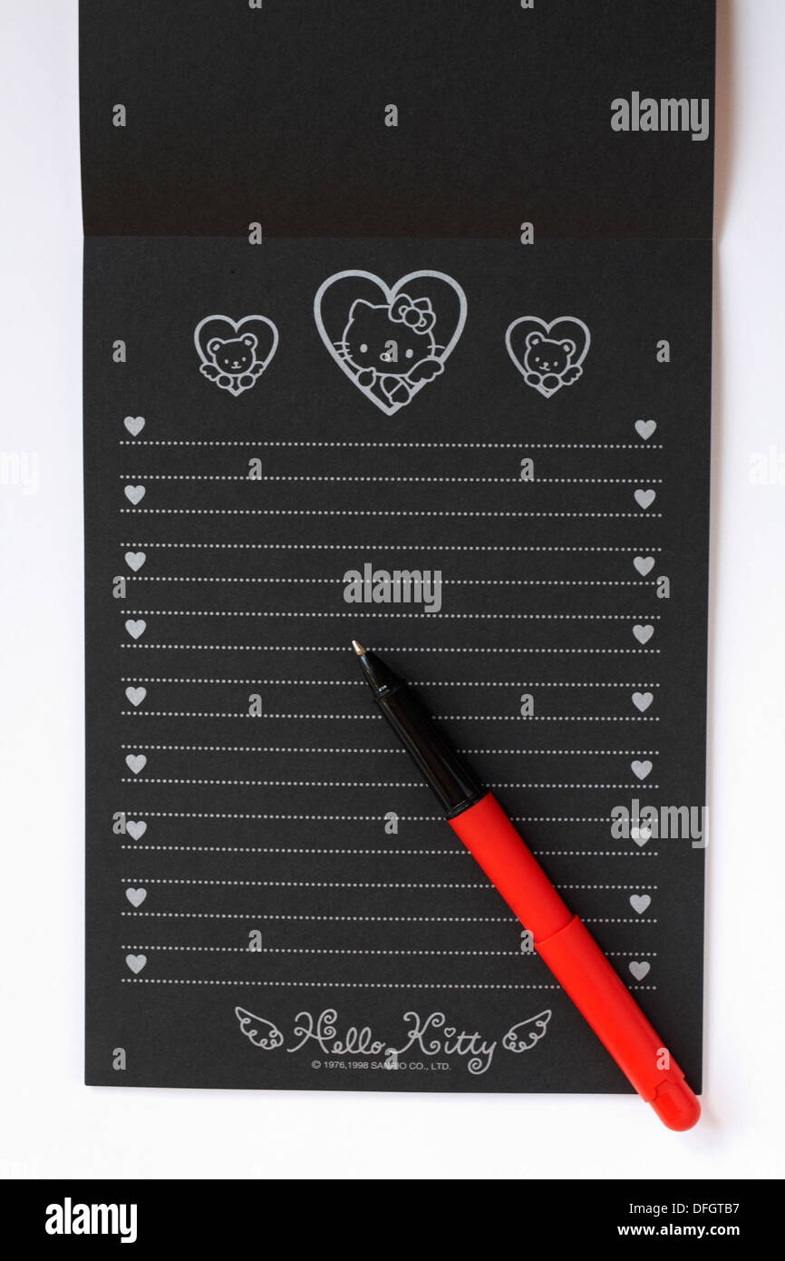 Hello Kitty black writing paper with red pen Stock Photo