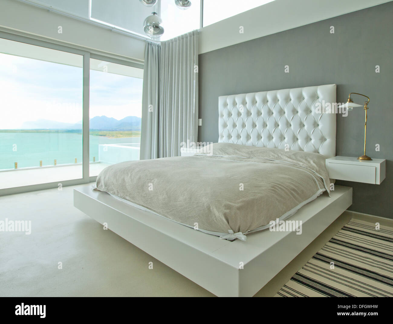 Modern bedroom overlooking ocean Stock Photo Alamy
