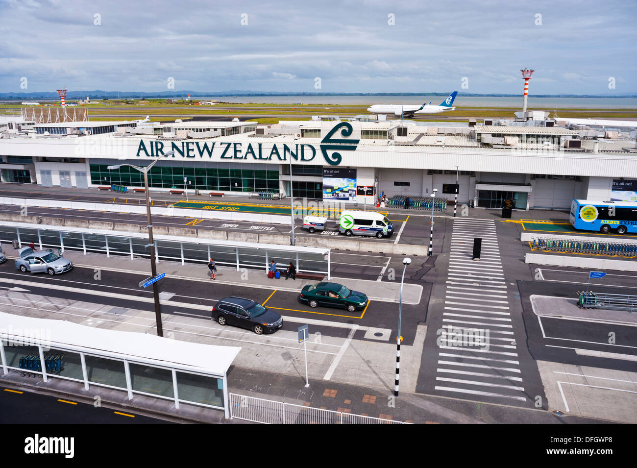 Auckland International Airport (domestic terminal), Auckland,South Island, New Zealand, with taxiing aircraft Stock Photo