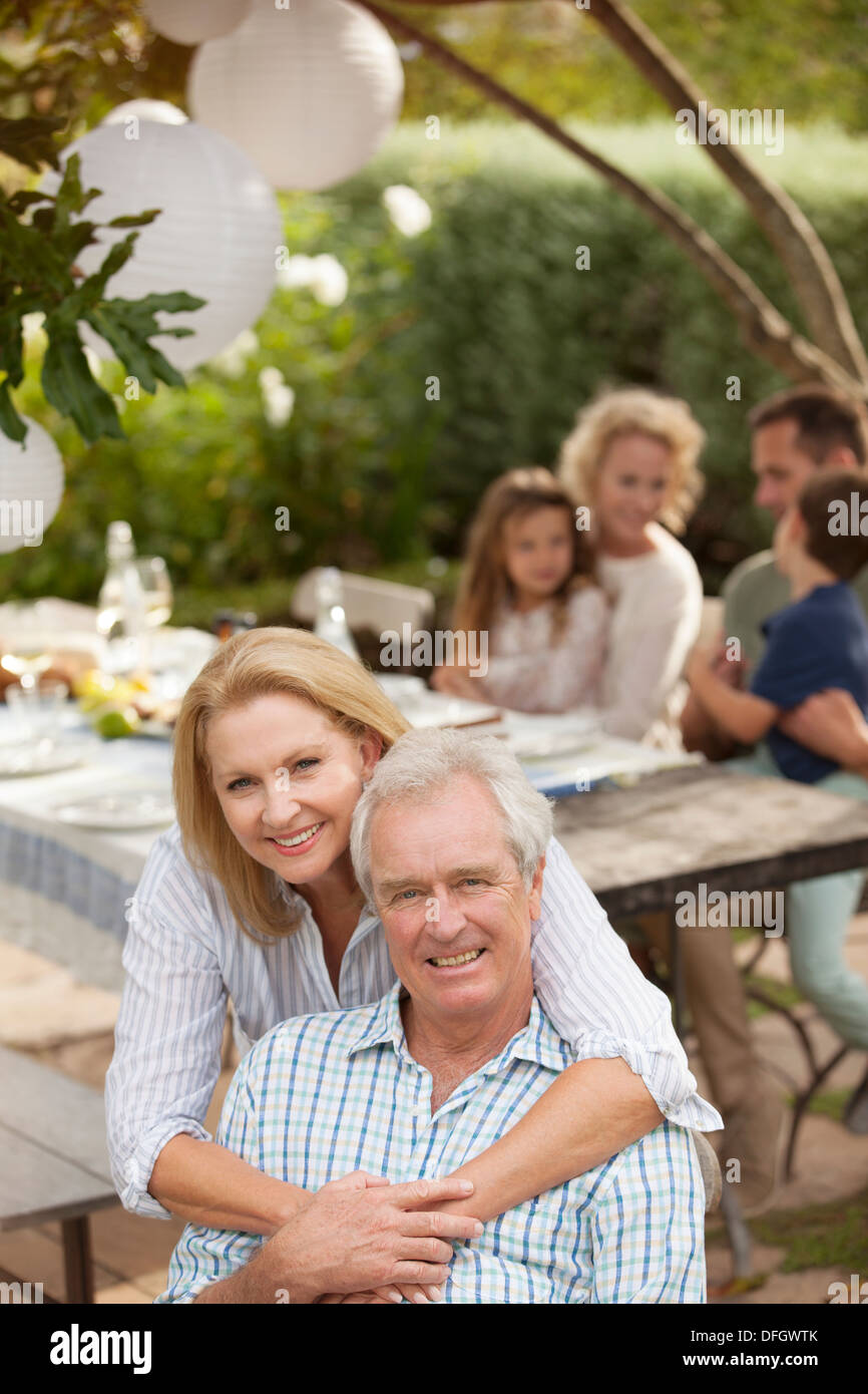 Portrait of smiling senior couple on patio Stock Photo