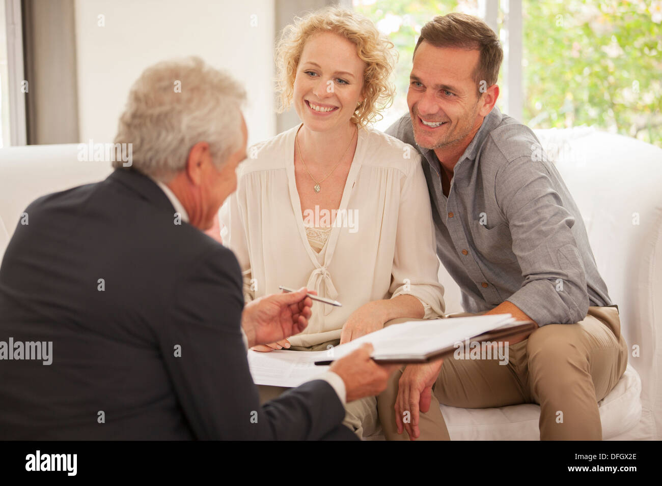 Financial advisor talking with clients Stock Photo