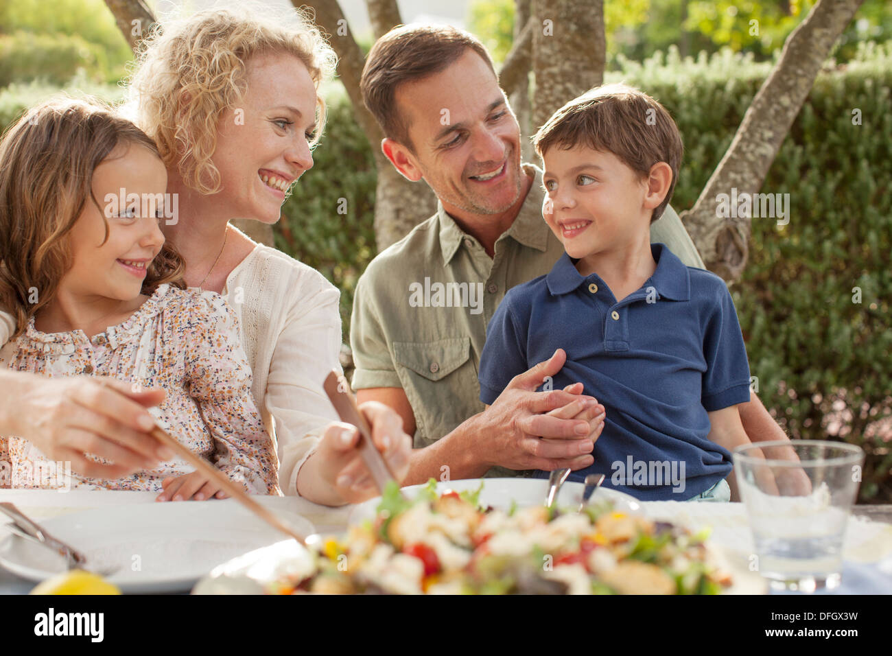 Family eating outdoors Stock Photo