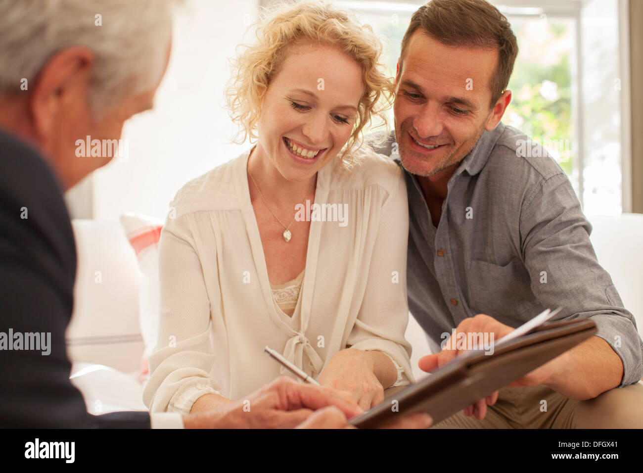 Financial advisor meeting with couple Stock Photo