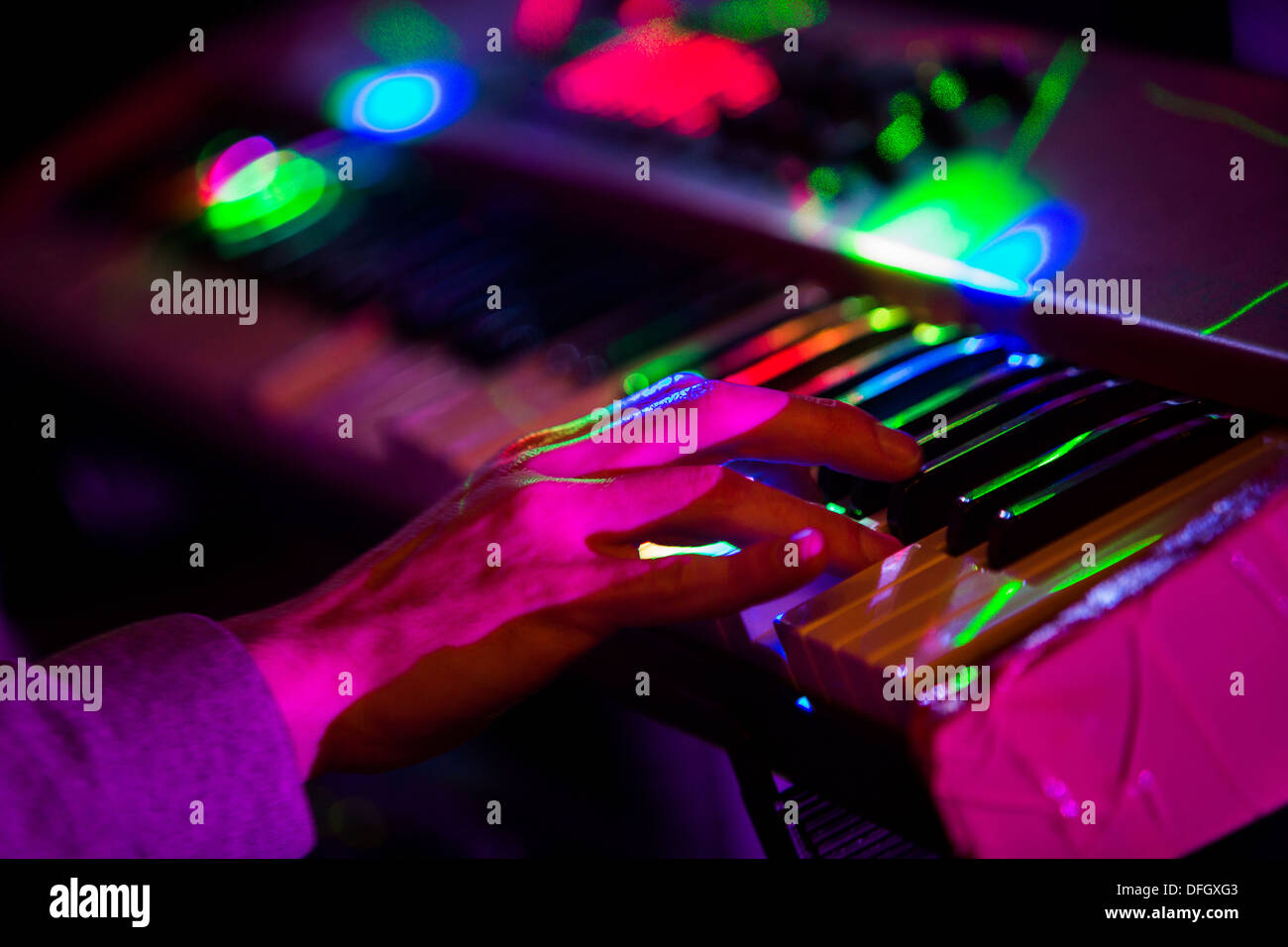 Stage lights on a keyboard during a concert. Stock Photo