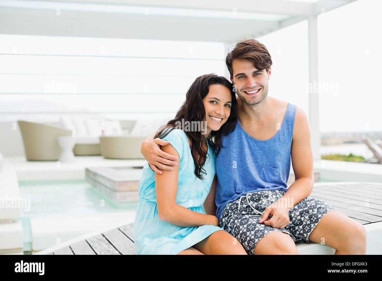 Couple hugging on bridge in hi-res stock photography and images - Alamy