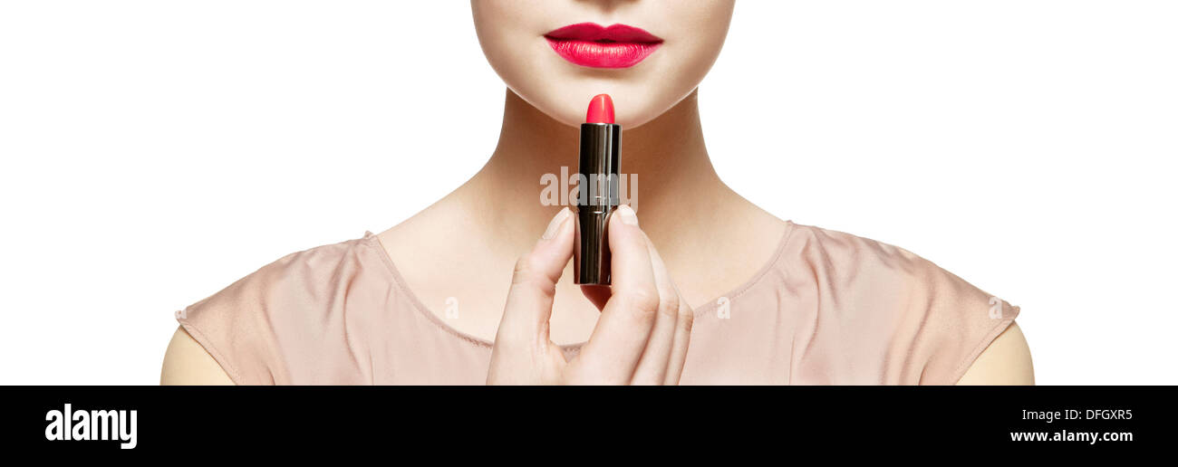 Close up of woman applying red lipstick Stock Photo