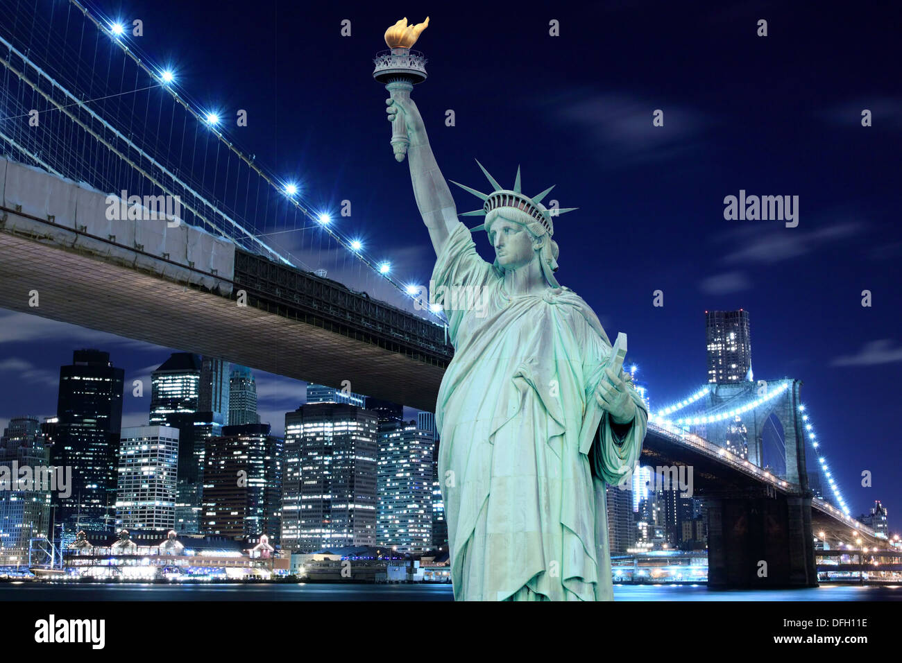 Brooklyn Bridge and The Statue of Liberty at Night, New York City Stock Photo