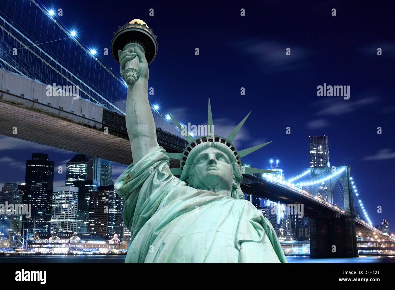 Brooklyn Bridge and The Statue of Liberty at Night, New York City Stock Photo