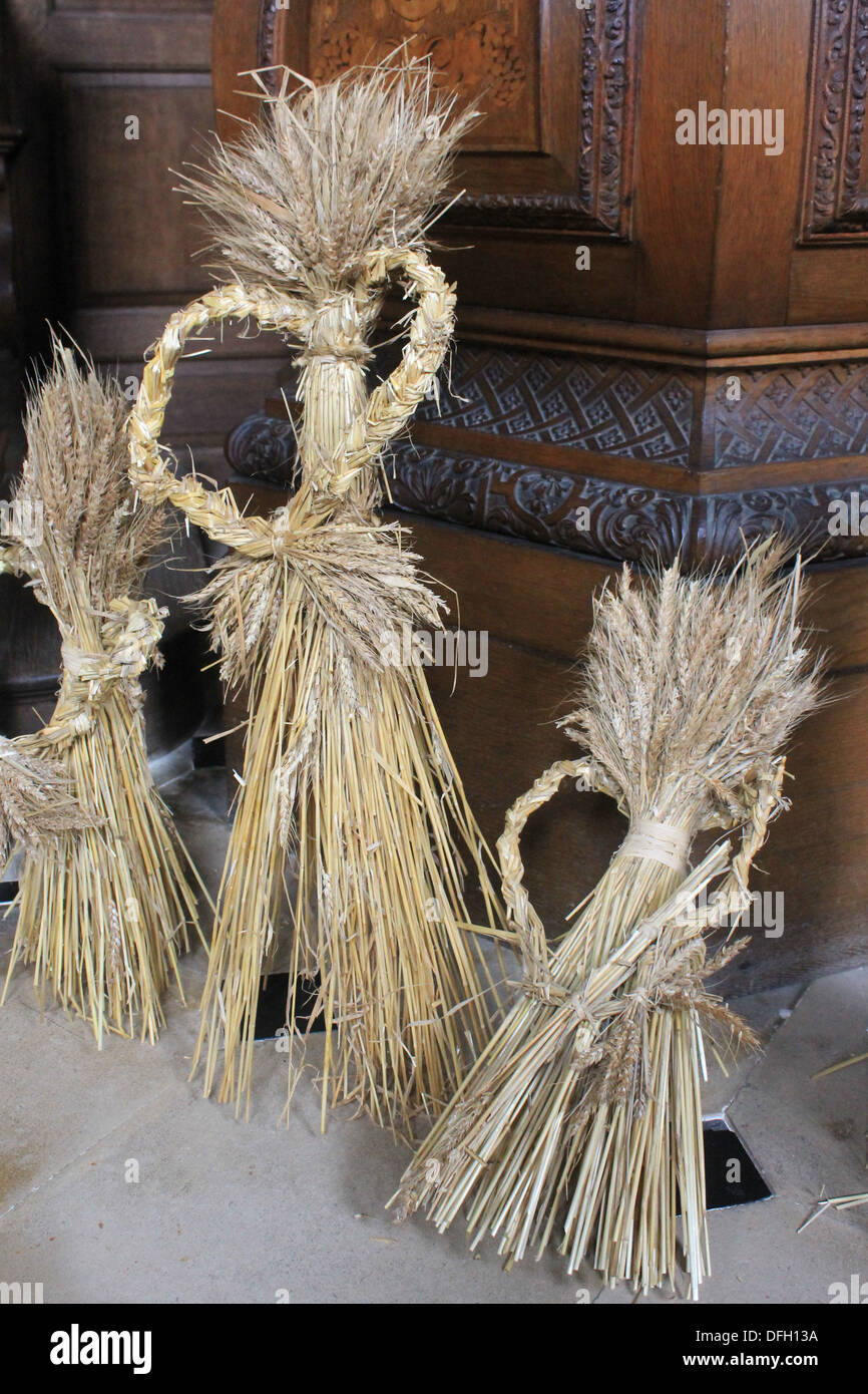 Corn dollies in a celebration of harvest festival at the chapel of Wimpole Hall, Cambridgeshire, UK Stock Photo