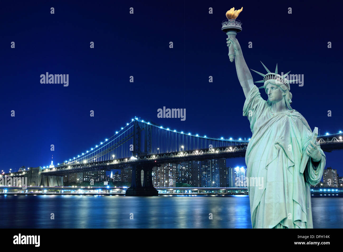 Brooklyn Bridge and The Statue of Liberty at Night, New York City Stock Photo