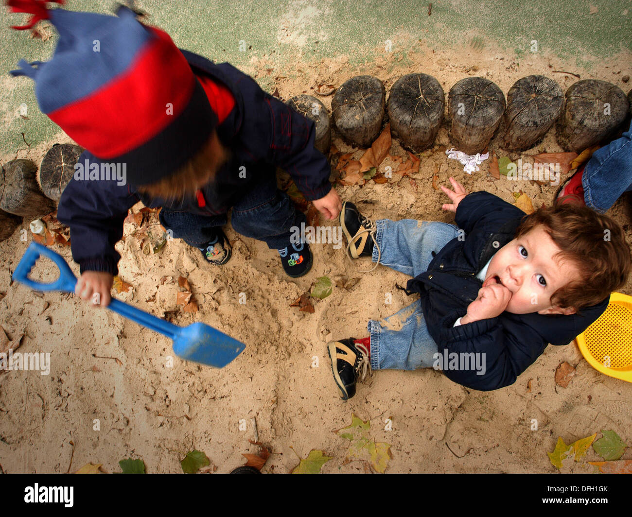 children playing in sand pit Stock Photo - Alamy