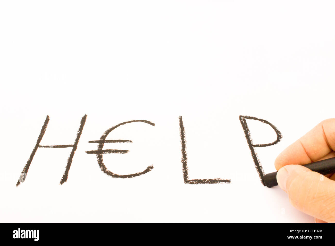 Hand writing the word HELP with crayon on white paper Stock Photo